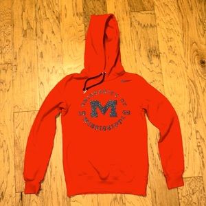 Ladies Nike red Ole Miss hoodie with glitter logo.